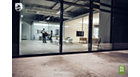 Office areas: furniture and people behind a glass window