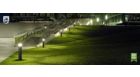 Outside park with evening lights and green grass