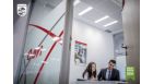 A woman and a man sitting in an office room
