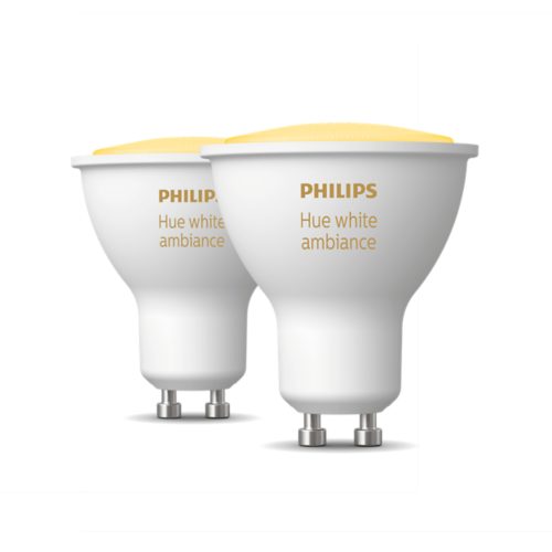 A collection of GU10-shaped white smart light bulbs with matte finish, labeled Hue white ambiance in gold text.