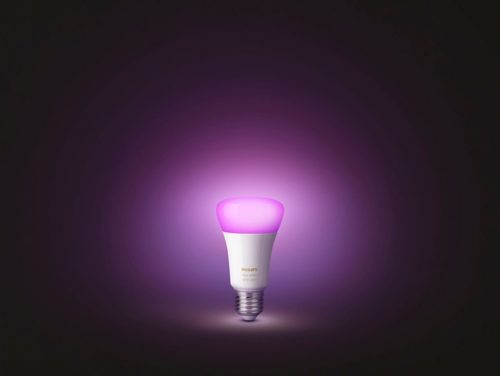 Smart light bulb with a rounded shape, glossy white base, and pink illuminated top, featuring a visible screw fitting.