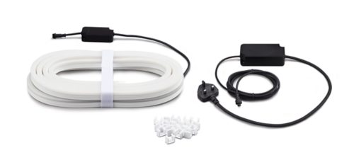 Coiled white light strip, two black power adapters with attached cables, and a collection of white mounting clips on a white surface.