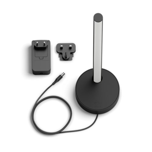 A black table lamp with a vertical light bar, a power adapter with cable, and a UK plug adapter are visible on a white background.
