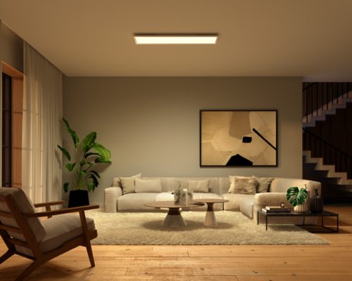 Rectangular ceiling panel light mounted above a living room seating area, illuminating a sofa, table, and wall art below.
