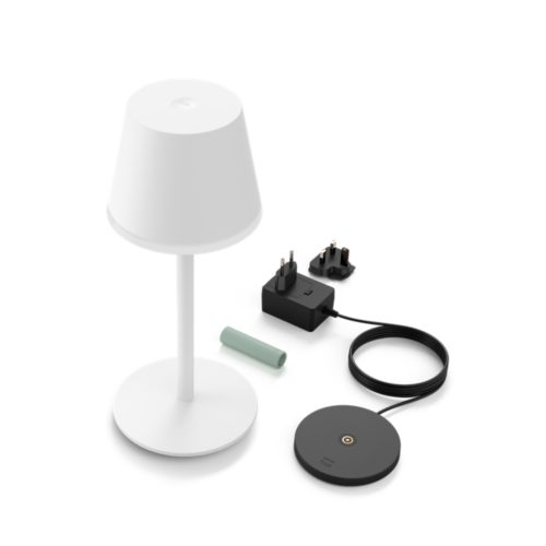 A white portable lamp, a charging base, a power adapter with two plug types, and a cylindrical battery are visible.