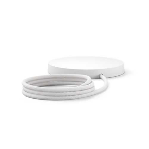 White round mounting kit with matte finish, featuring a braided cable extending from the side, shown coiled in front.