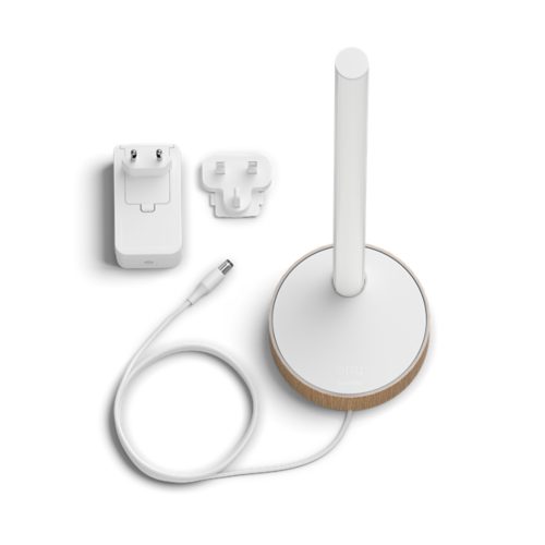A white table lamp with a cylindrical light, a power adapter, a plug attachment, and a connected cable on a white background.