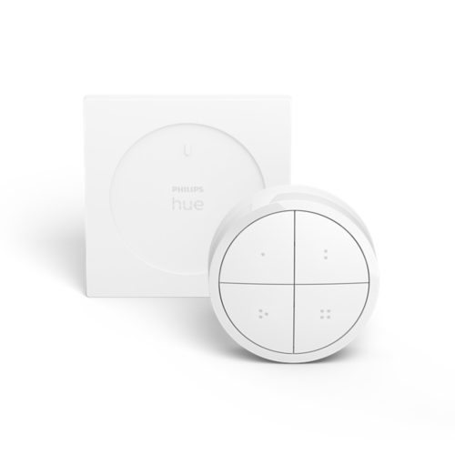 White Tap dial switch with a round shape, matte finish, four buttons, and a square wall mount in the background.