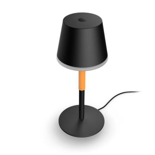 Belle portable lamp, table shape, black color with matte finish, orange accent on stem, visible power cord, compact design.