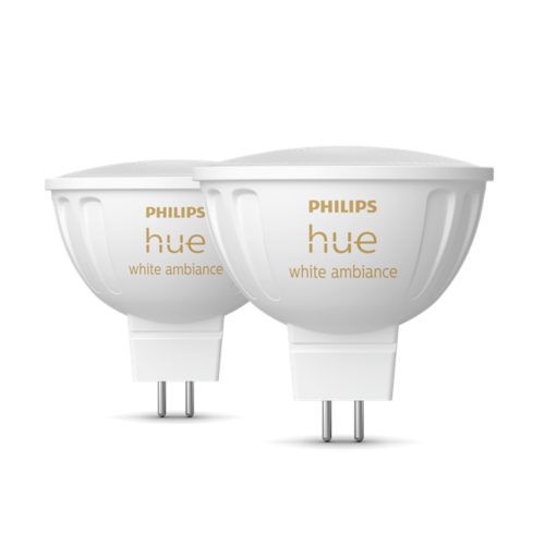 A set of white smart light bulbs with visible prongs, featuring hue white ambiance text on the side.