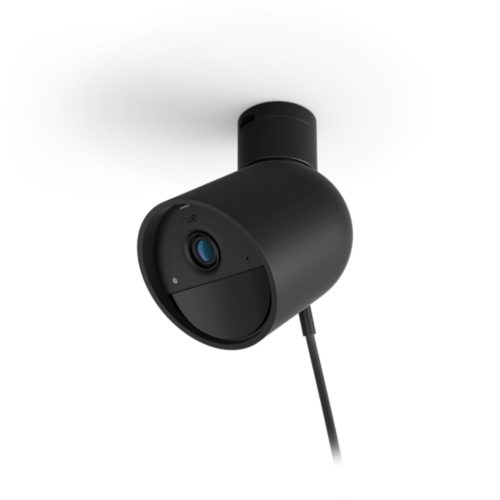 Wired black cylindrical security camera with matte finish, visible lens, indicator light, and attached cable, mounted on a surface.