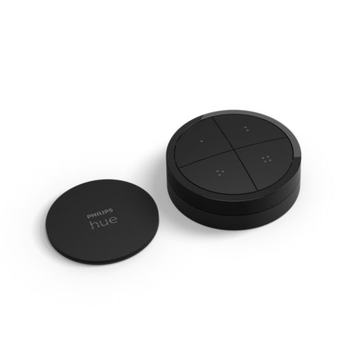 Black circular smart tap dial switch with matte finish, featuring four touch buttons and a separate matching mini mount.