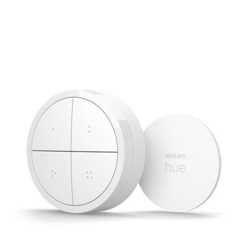 White Tap dial switch with round shape, matte finish, four buttons, and visible text PHILIPS hue on the compact mount.
