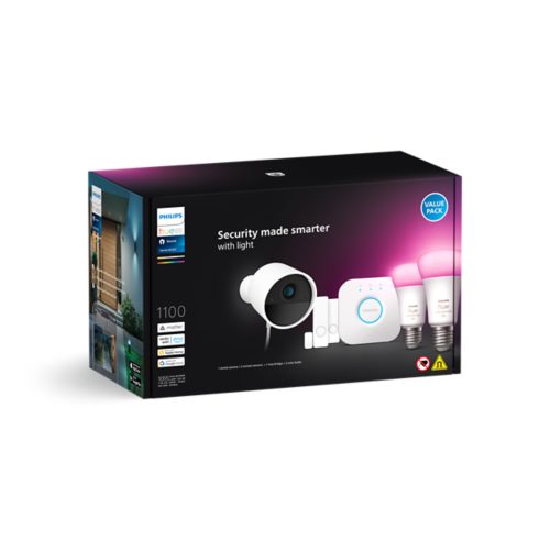 Product packaging featuring a security camera, sensors, hub, and light bulbs with pink illumination. Text reads Security made smarter with light.