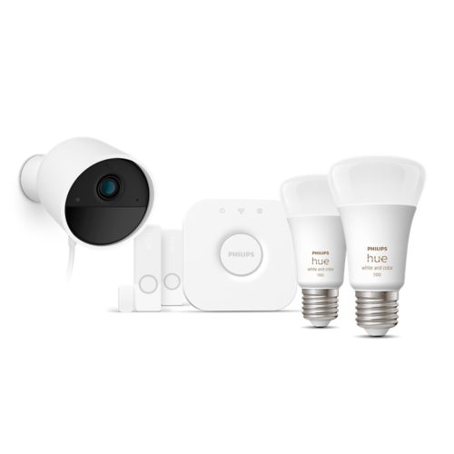 A collection of smart lighting bulbs, a security camera, sensors, and a central hub, all in white, shown as a connected set.