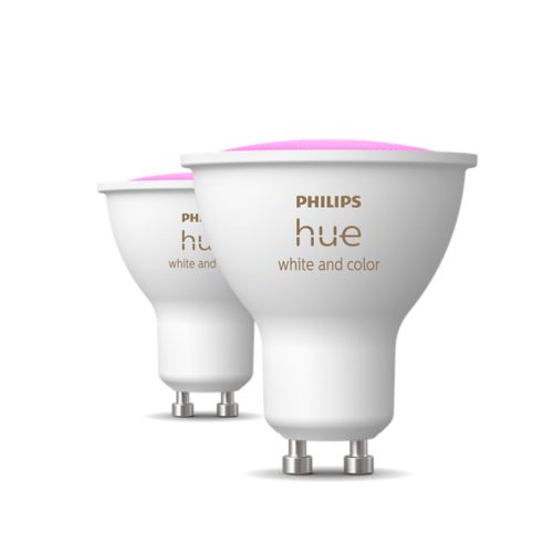 A set of white smart GU10 light bulbs with visible white and color text and pink-tinted tops on a plain background.