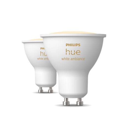 A set of white smart GU10 light bulbs with hue white ambiance text printed on each bulb, shown against a white background.