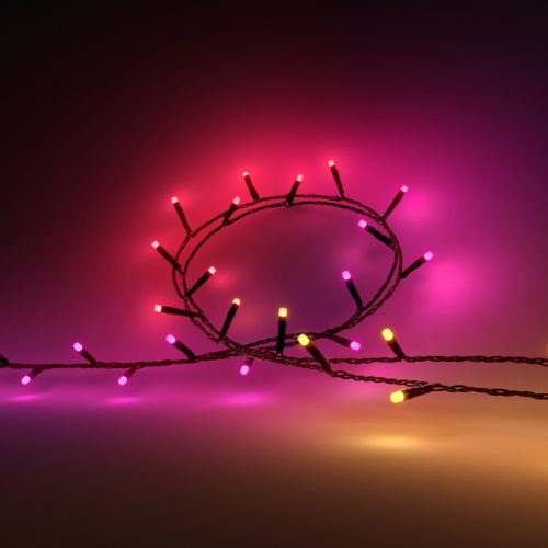 A boxed smart lighting kit with a visible round light and remote control, packaging text reads Light for your moments.