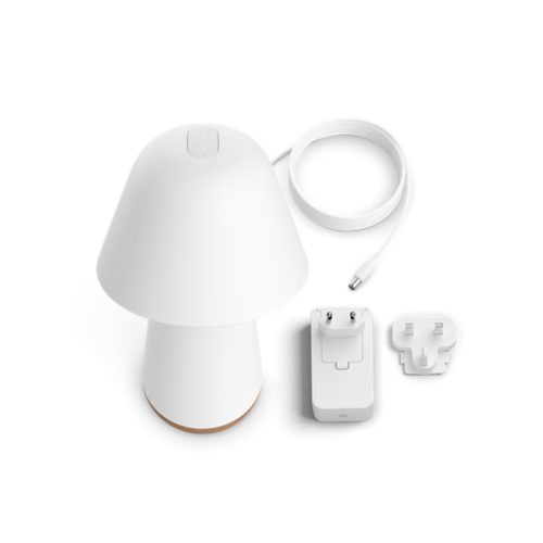A white bedside lamp, a power adapter with two plug options, and a coiled charging cable are displayed on a white background.