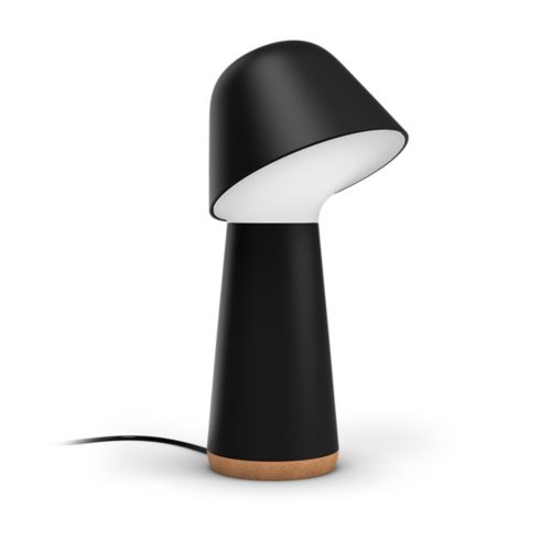 Twilight bedside lamp, mushroom-shaped, black color with a matte finish, white inner shade, compact design, cork base, visible cord.