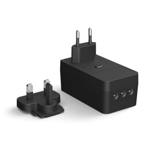 Black Play light bar power adapter with a rectangular shape, matte finish, two plug types, and visible connector ports.