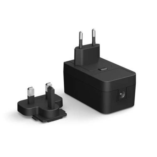 Black power adapter with a rectangular shape, matte finish, visible plug, detachable adapter head, and a single port on the side.
