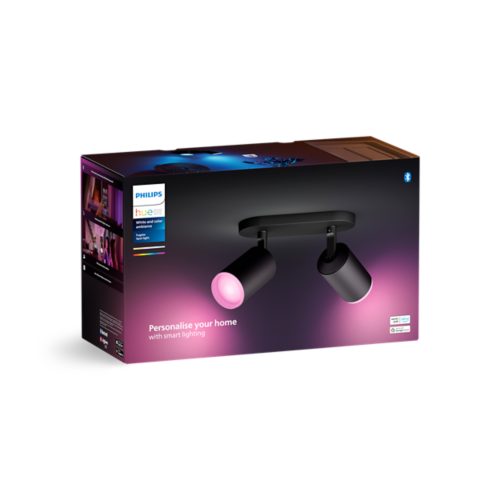 Product packaging showing a black smart spotlight fixture with adjustable heads emitting pink light, text reads Personalise your home.