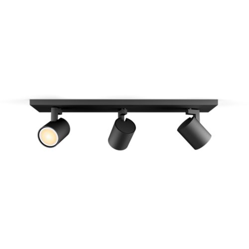 Black Runner bar tube ceiling light with three cylindrical spotlights, matte finish, one spotlight illuminated, no visible switches.