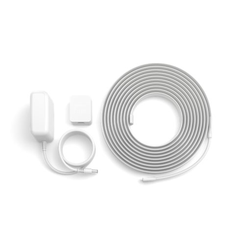 Coiled lightstrip, power adapter with cable, and a control unit labeled Hue displayed on a white background.