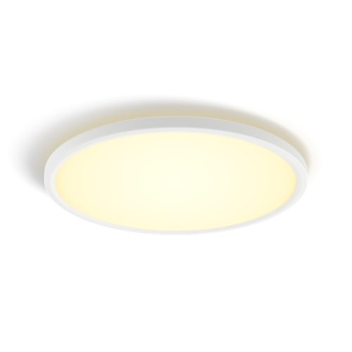 Round slim ceiling light, white frame, flush-mount design, emitting soft yellow illumination, matte finish, compact profile.