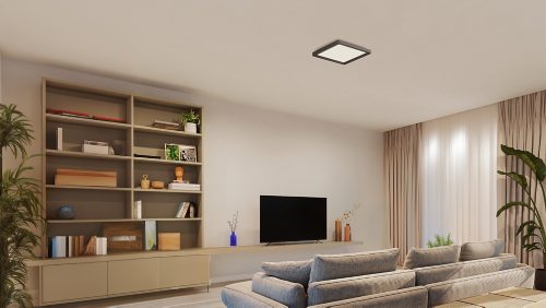 Square black ceiling panel light installed centrally, emitting white light over a living room with shelving, TV, and seating area.