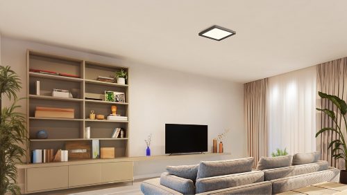 Square black ceiling panel light mounted centrally, emitting bright illumination over a living room with shelves and a television.