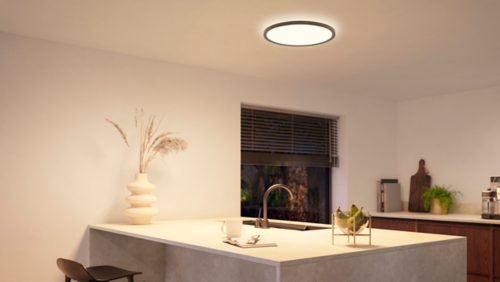 White Adore Hue bar tube light, cylindrical shape with two adjustable spotlights, matte finish, no visible switches or ports.