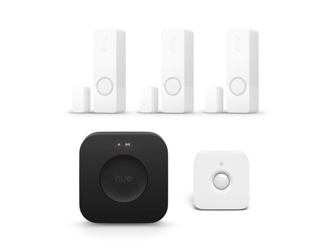Close up of front of 3 Secure contact sensors in white + motion sensor + Bridge Pro