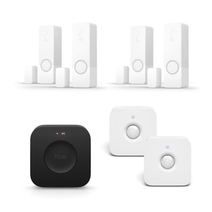 Primo piano della parte anteriore di 4 sensori di contatto Secure bianchi + 2 sensori di movimento + Bridge Pro