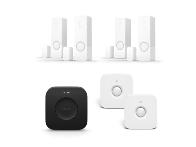 Close up of front of 4 Secure contact sensors in white + 2 motion sensors + Bridge Pro